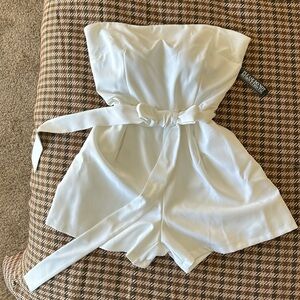 White strapless romper with waist tie. New with tags- never worn.